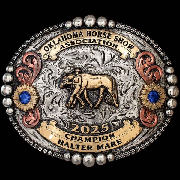 "A Western classic — our Texhoma Belt Buckle.
Handcrafted on a German Silver base, with immaculate details on every inch. This buckle design features a berry and bead edge combination, Copper scrolls accented with sunflowers, and your choice of cubi